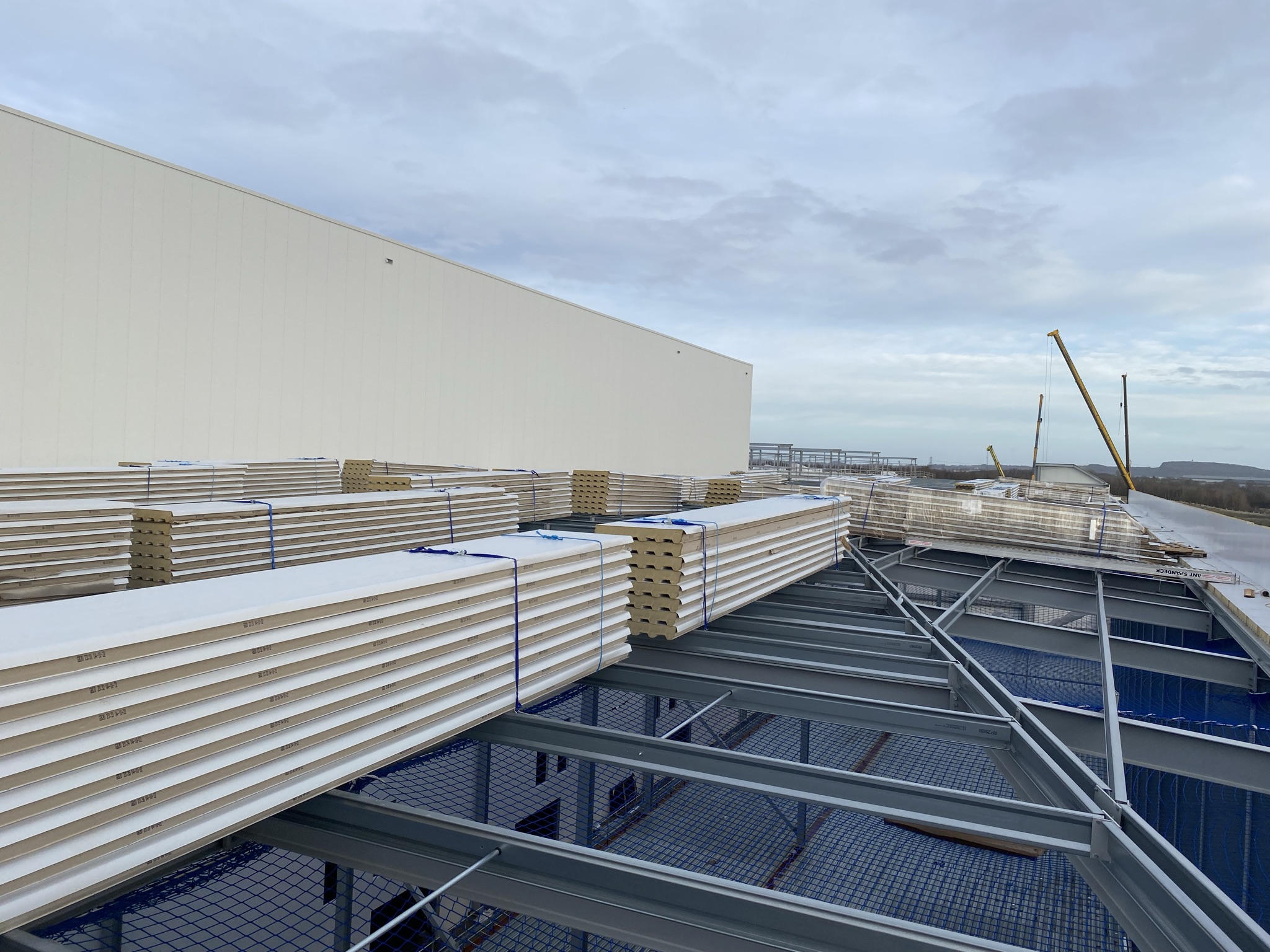 Roof construction materials staged for installation