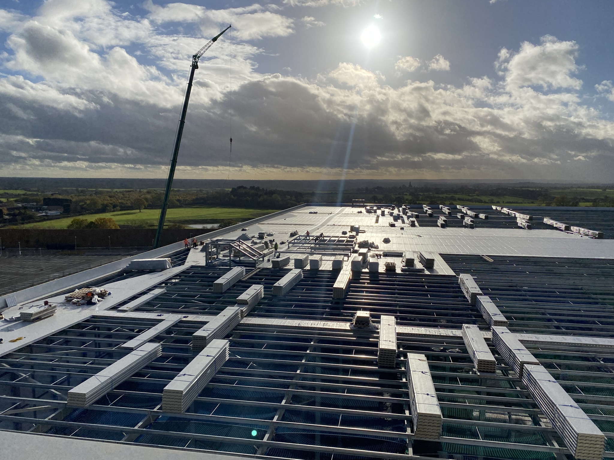 Roof works and crane operations on a commercial project